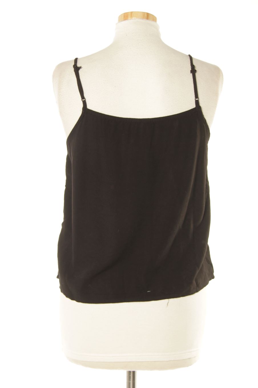 Top H&M de la taille 36, de couleur noir