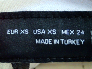 Pantalón de Zara de la talla XS, de color beige