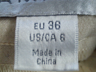Jupe Amisu de la taille 36, de couleur beige