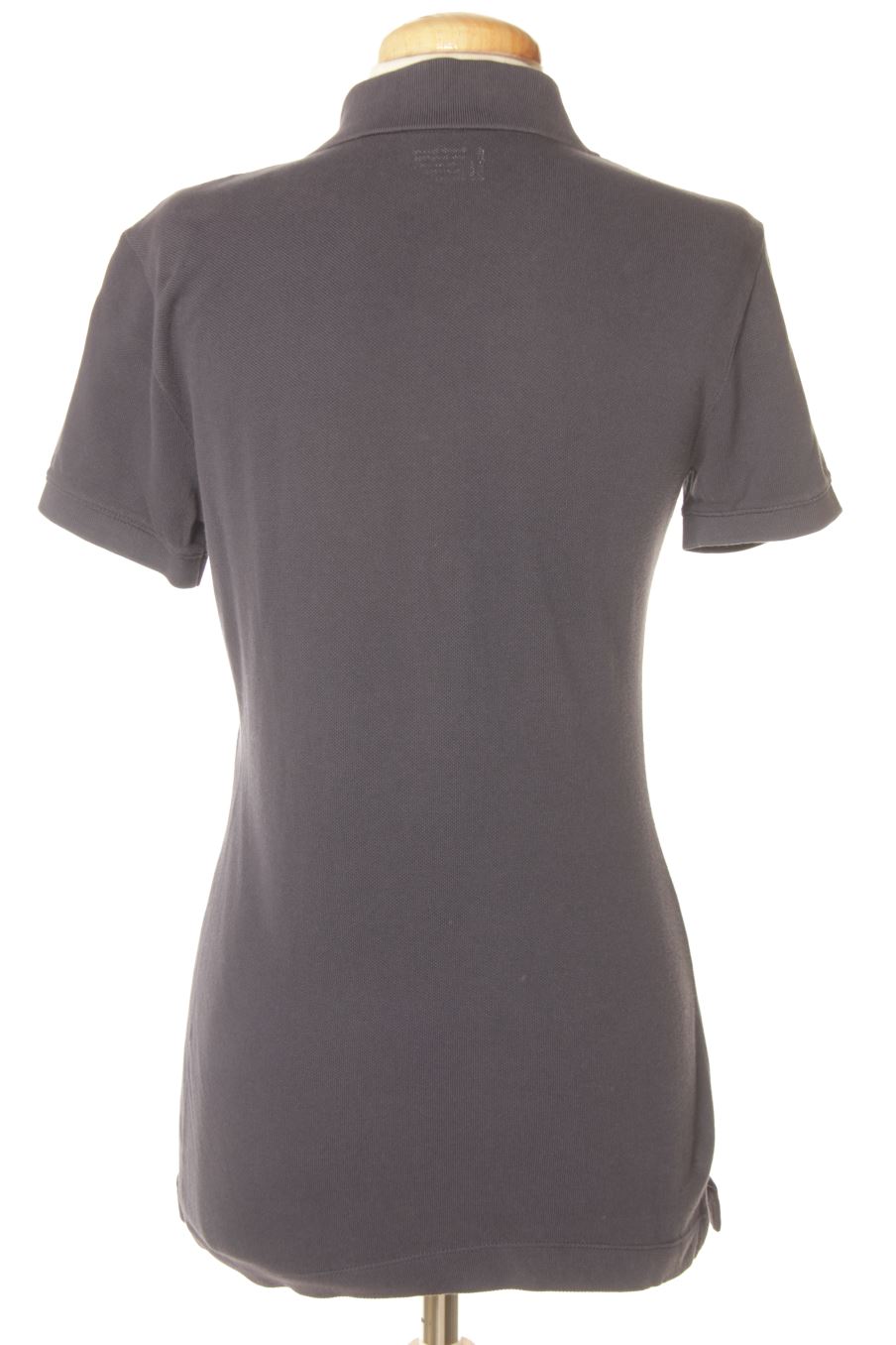 Polo Benetton de la taille S, de couleur bleu marine