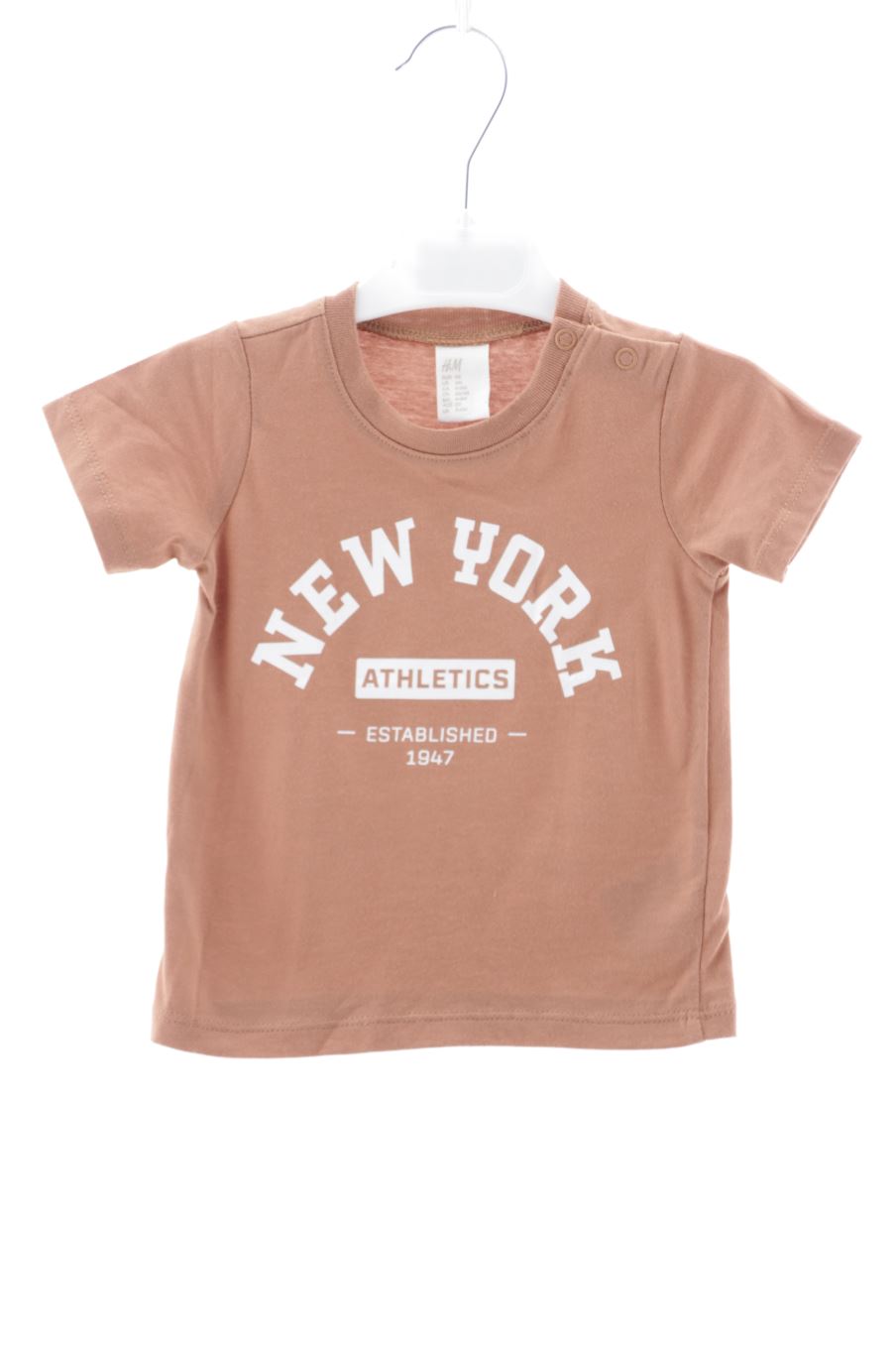 T-shirt H&M de la taille 6 mois avec une étiquette