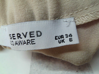 Pantalon Reserved de la taille 34, de couleur beige