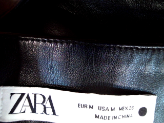 Jupe Zara de la taille M, de couleur noir de synthétique