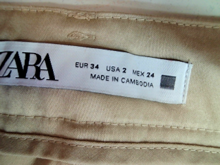 Pantalón de Zara de la talla 34, de color beige